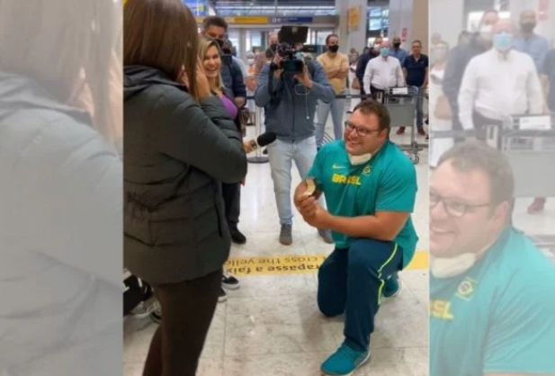 Campeão mundial Darlan Romani pede esposa em casamento no aeroporto após título